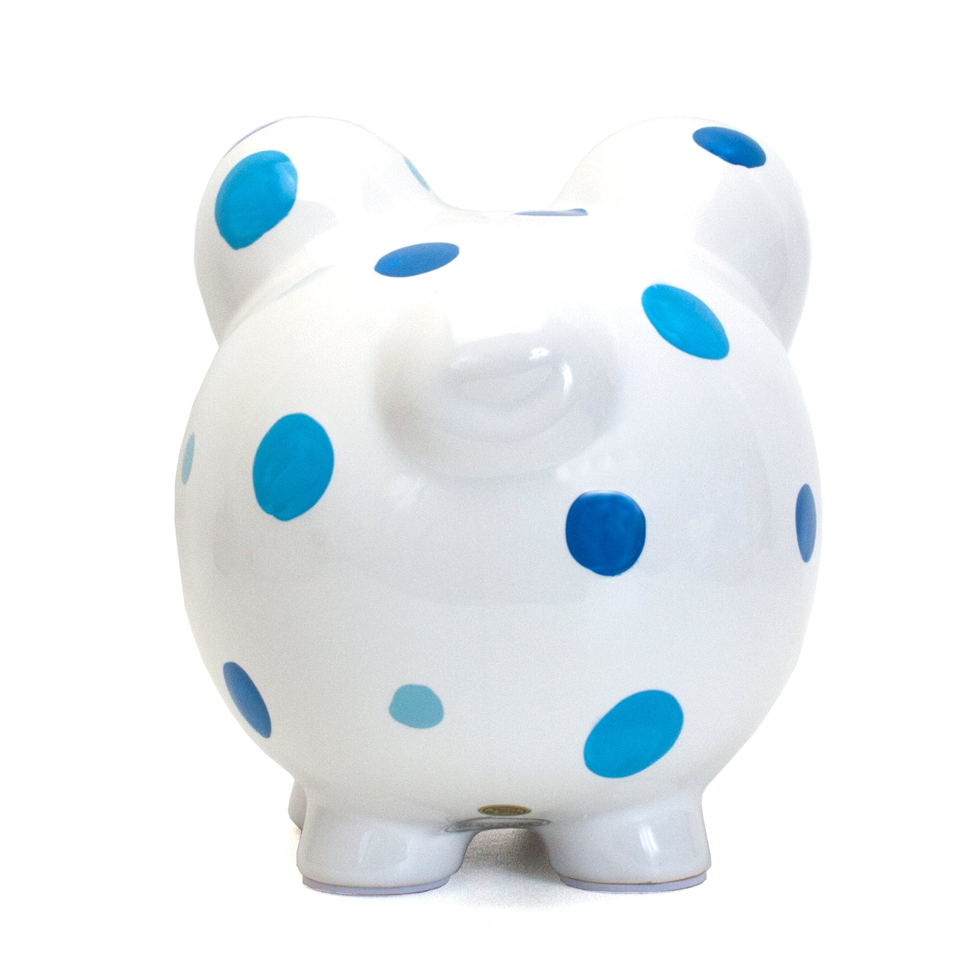 Back view of white piggy bank decorated with blue polka dots