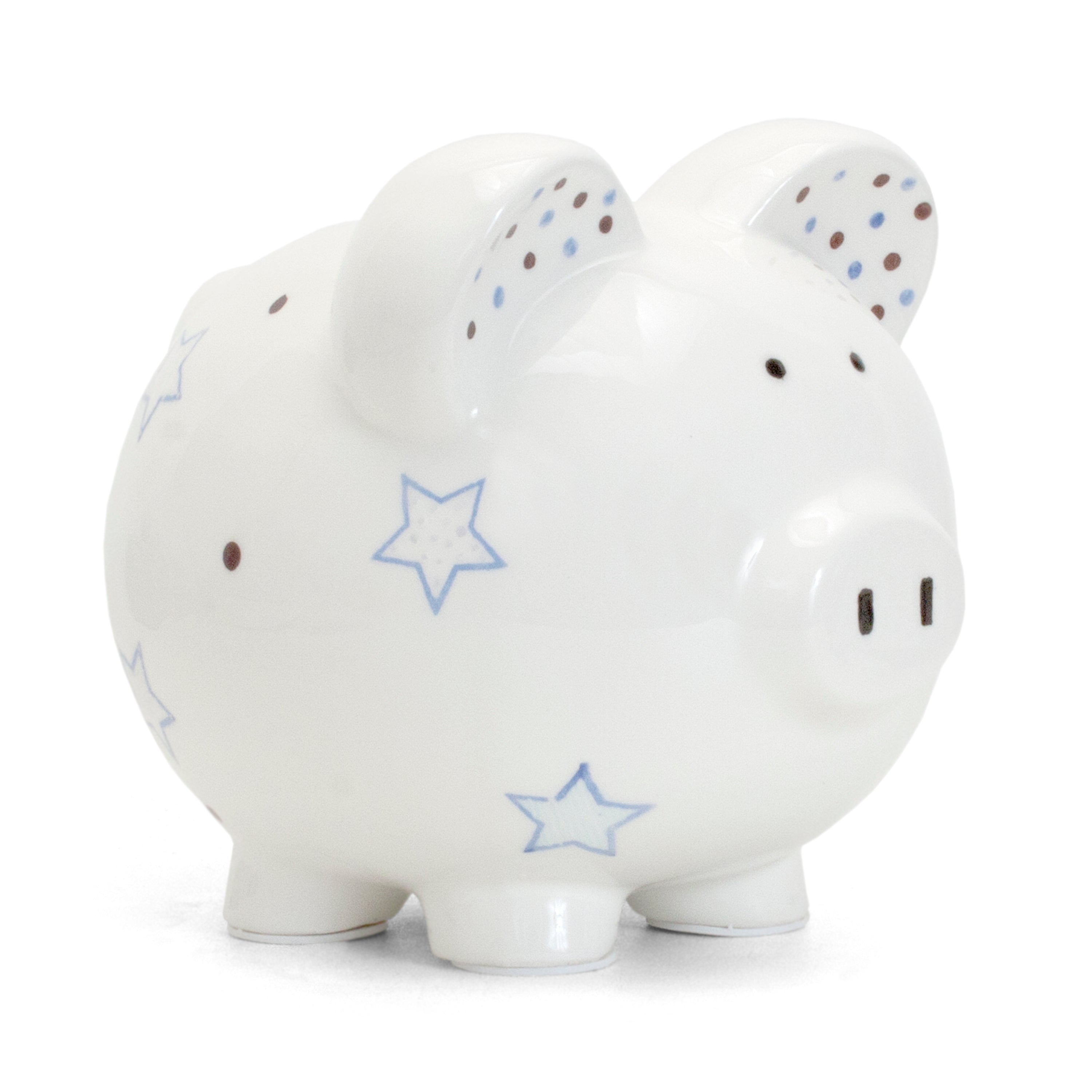 Right angled front view of white ceramic piggy bank with blue stars and brown dots