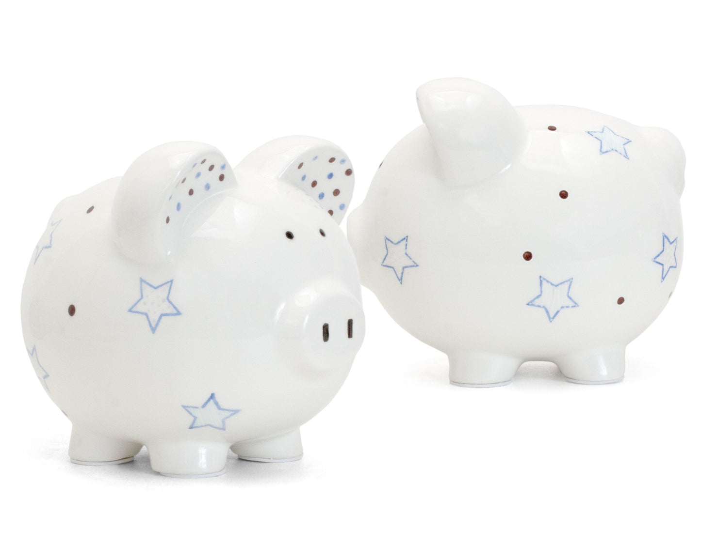 Two white ceramic piggy banks with blue star and brown dot design side by side