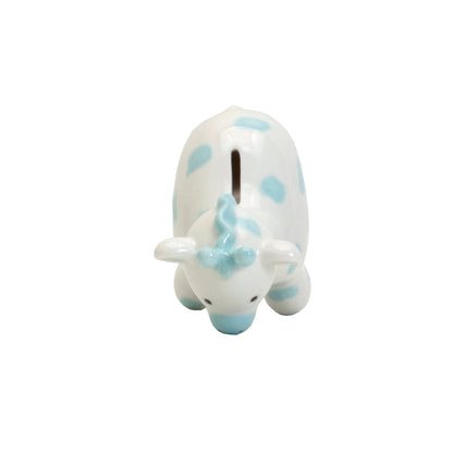 Top view showing coin slot on blue spotted ceramic giraffe piggy bank