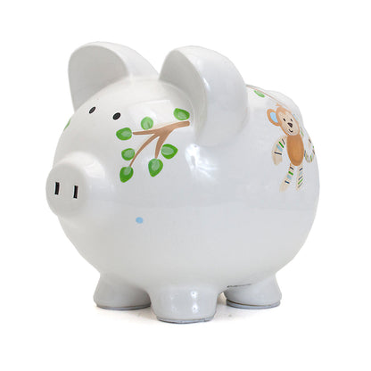 Side view showing monkey hanging from tree branch on Blue Tropical Punch piggy bank