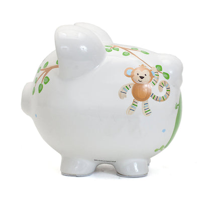 Side view showing elephant and partial giraffe on piggy bank