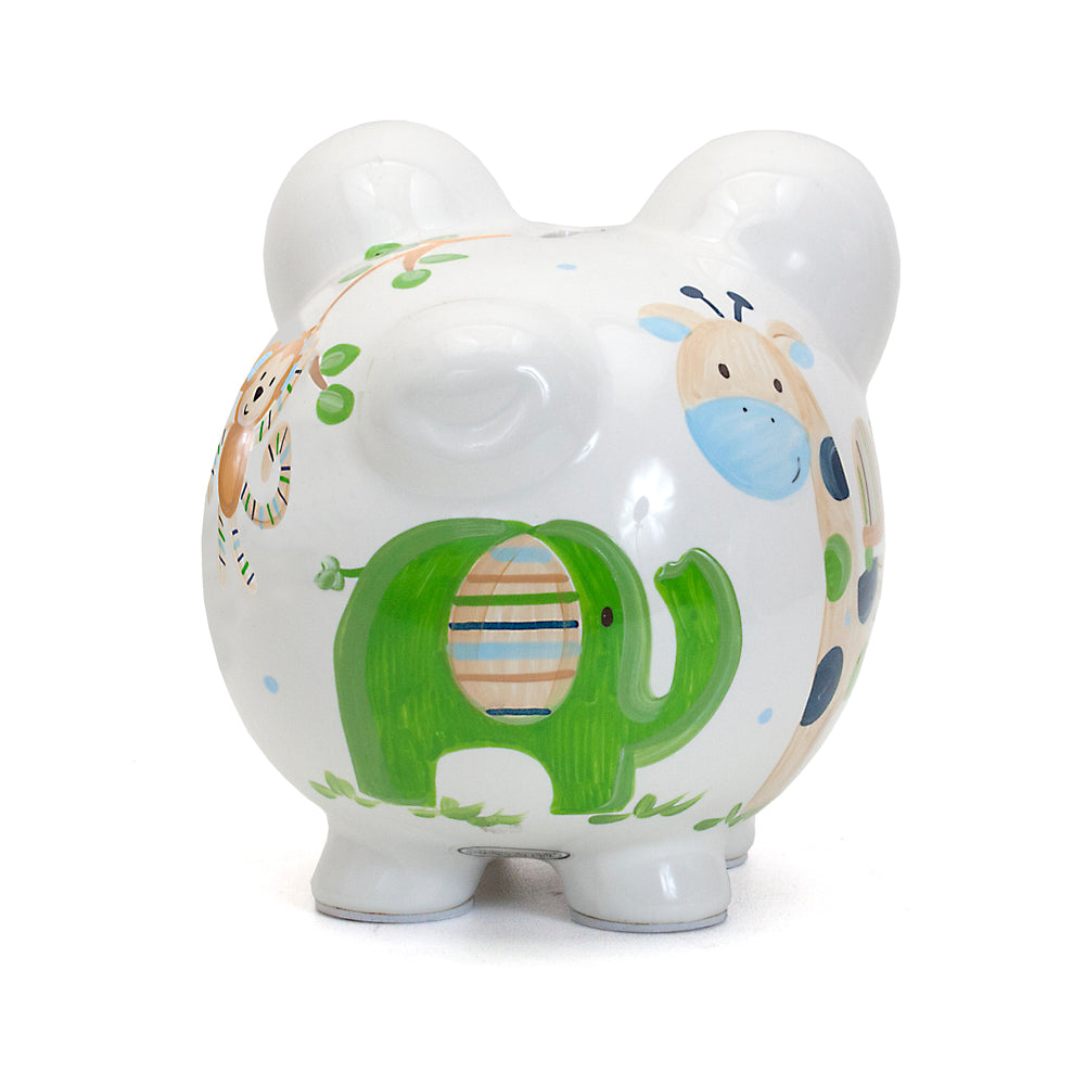 Top angled close-up of monkey hanging from tree branch painted on piggy bank