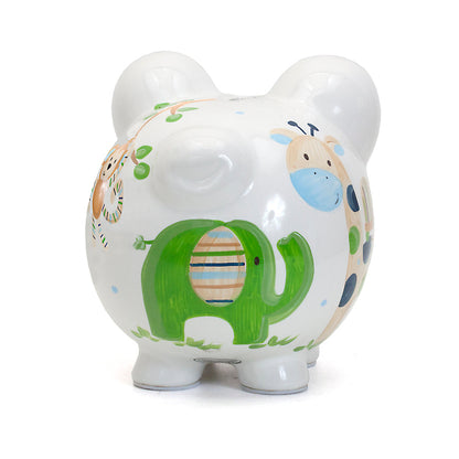 Top angled close-up of monkey hanging from tree branch painted on piggy bank