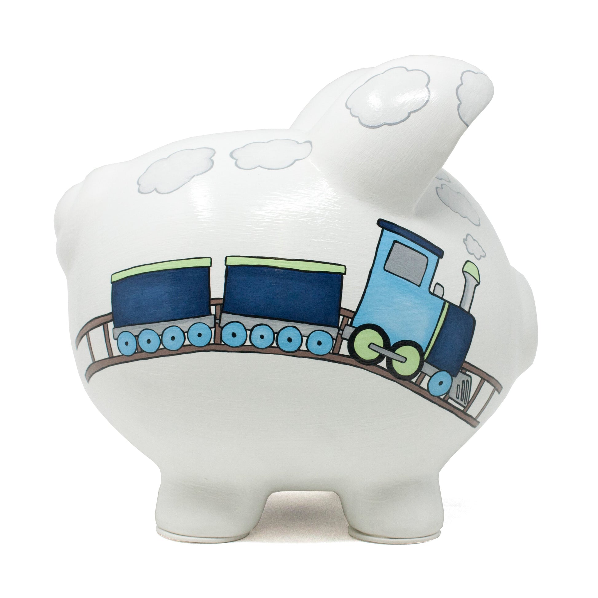 Close front angle of ceramic piggy bank with coin slot on top and black eye details