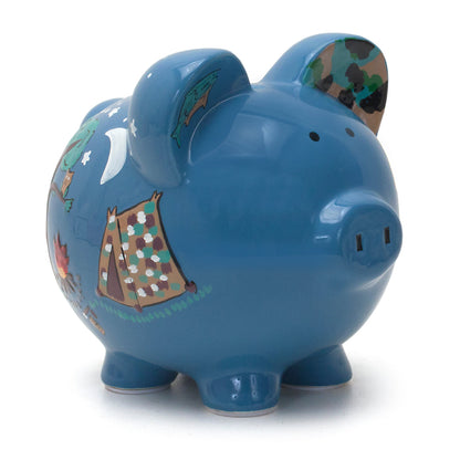 Blue piggy bank with handpainted camping scene including tent, campfire, tree, moon, and stars