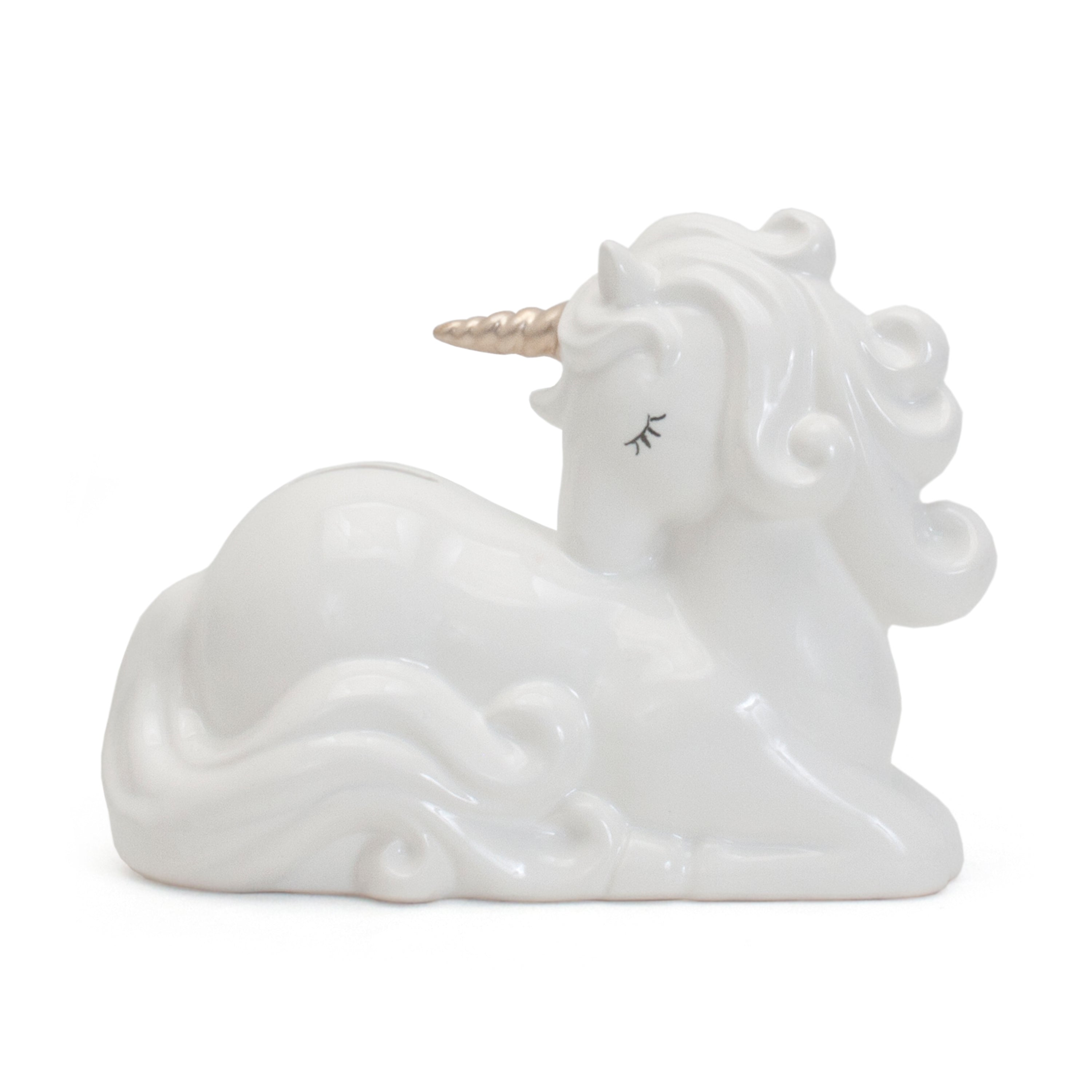 Charlie the Unicorn ceramic piggy bank side view showing white body and gold horn