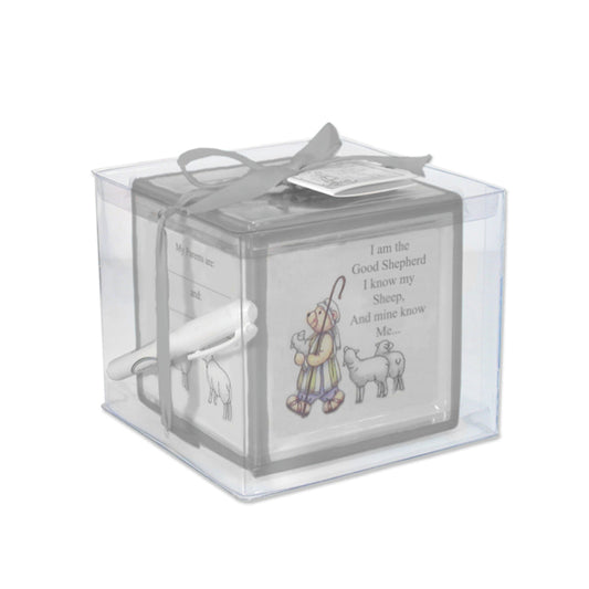 Ceramic christening block bank with handpainted design and gray border packaged in clear box with ribbon and pen