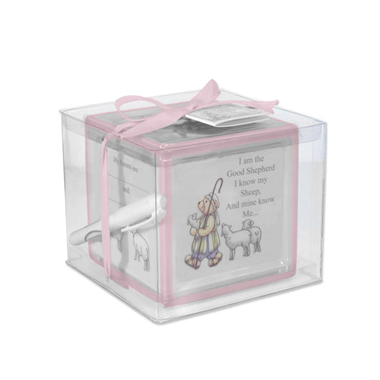 Pink ceramic christening block piggy bank with handpainted Good Shepherd design, packaged with pen inside clear box tied with pink ribbon