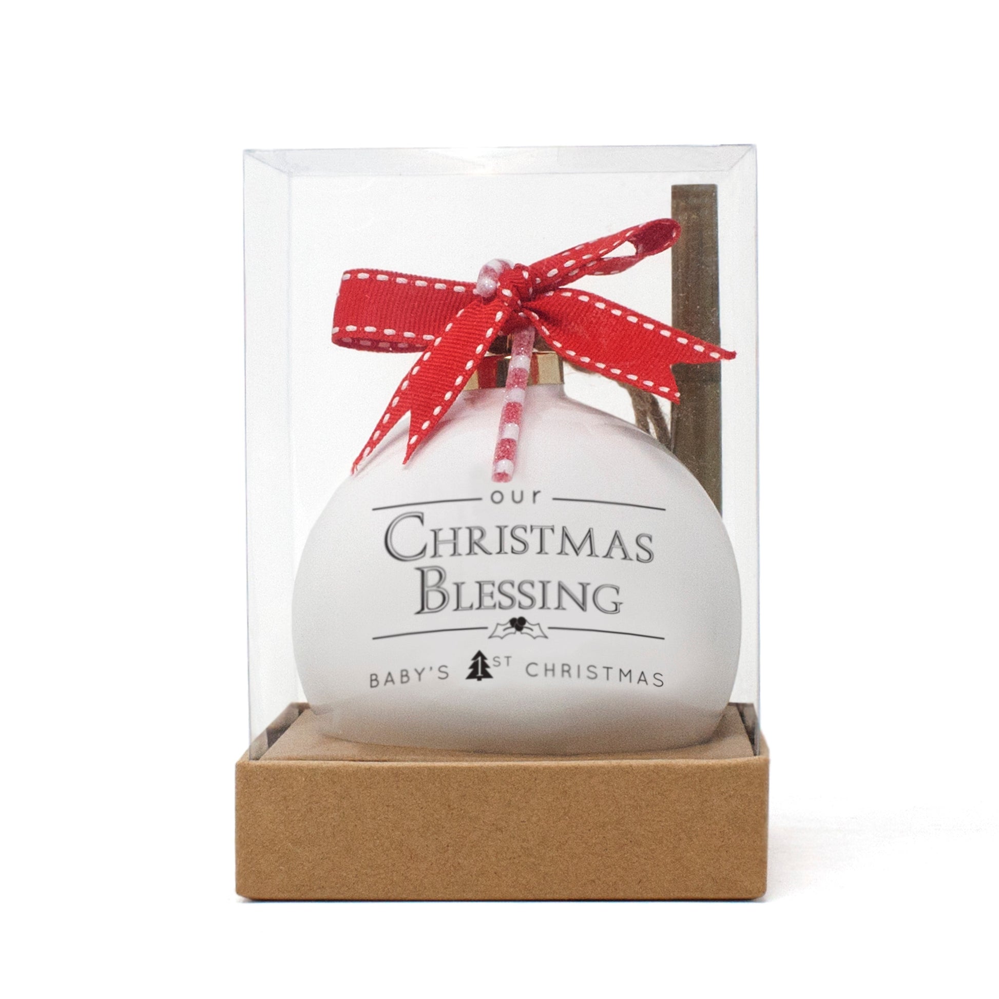 White porcelain Christmas ornament with red ribbon bow and 'Our Christmas Blessing Baby's 1st Christmas' text in clear display box
