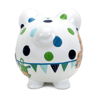 Back view of white ceramic piggy bank featuring colorful polka dots and circus animal decorations including a green monkey