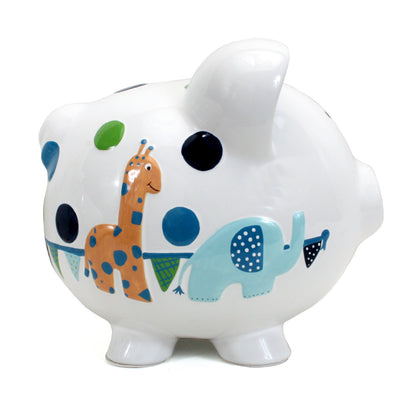 Front view of white ceramic piggy bank with two small black eyes and blue mottled ears