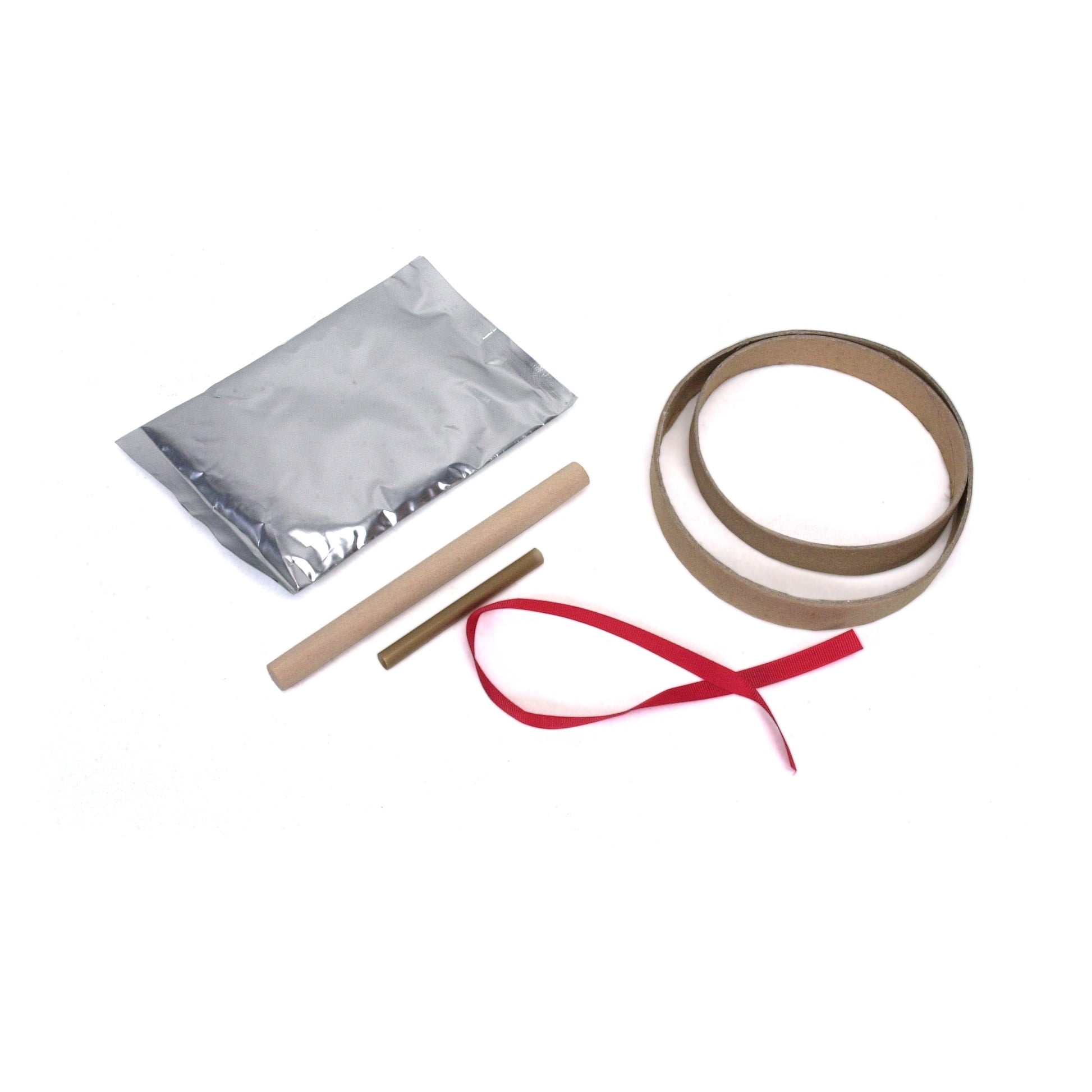 Contents of the kit laid out: air-dry marshmallow clay packet, rolling pin, hole punch tool, ribbon, and two round cookie cutters