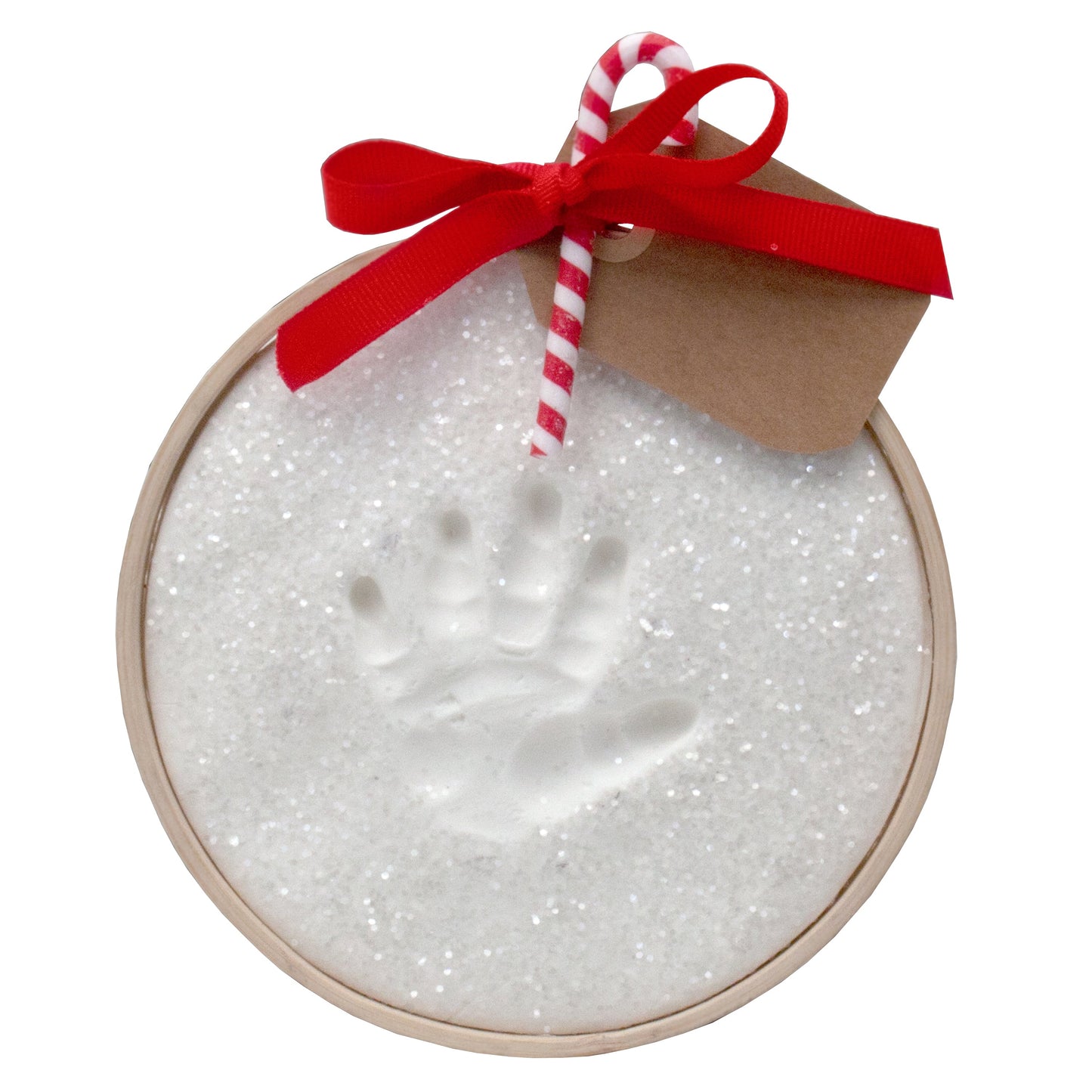 Close-up of finished Claydough ornament with child's handprint, red ribbon bow, and candy cane tag