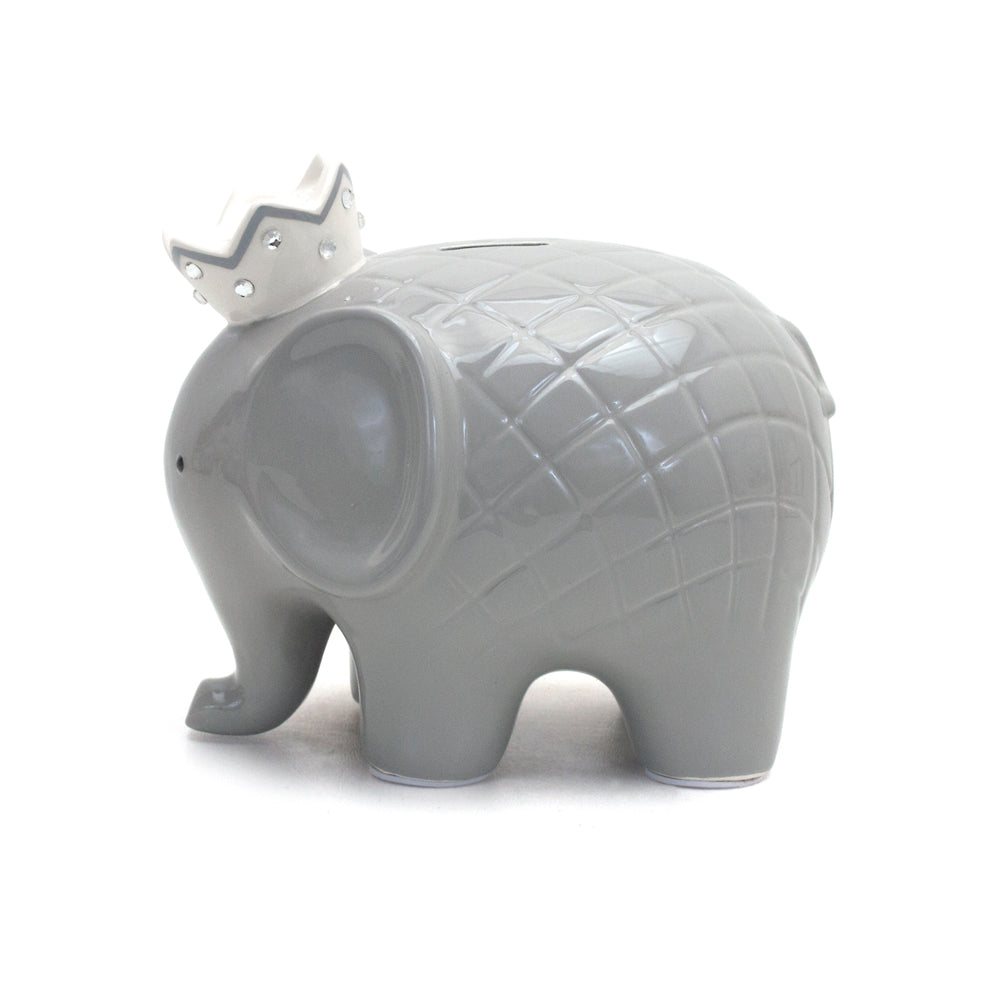 Side view of gray elephant piggy bank showing quilted textured body and tail detail