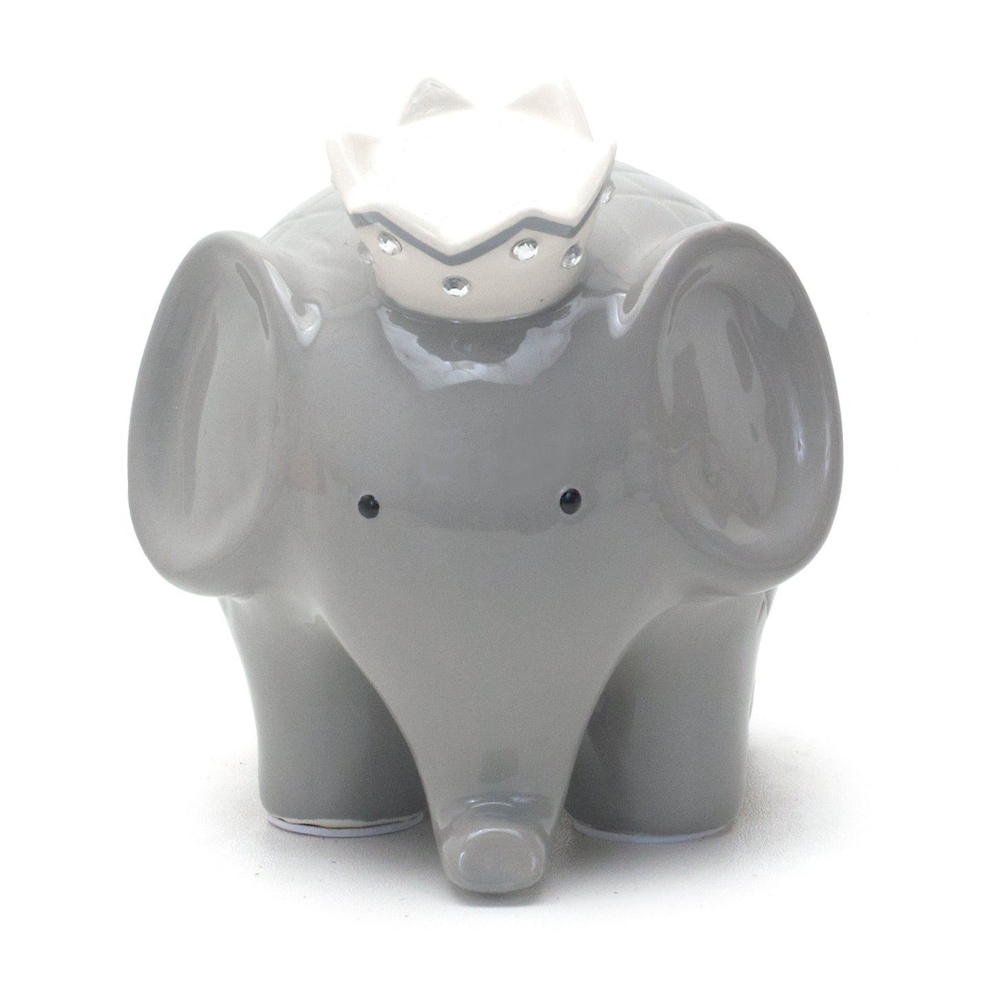 Close-up left side of gray elephant piggy bank focusing on ear and crown
