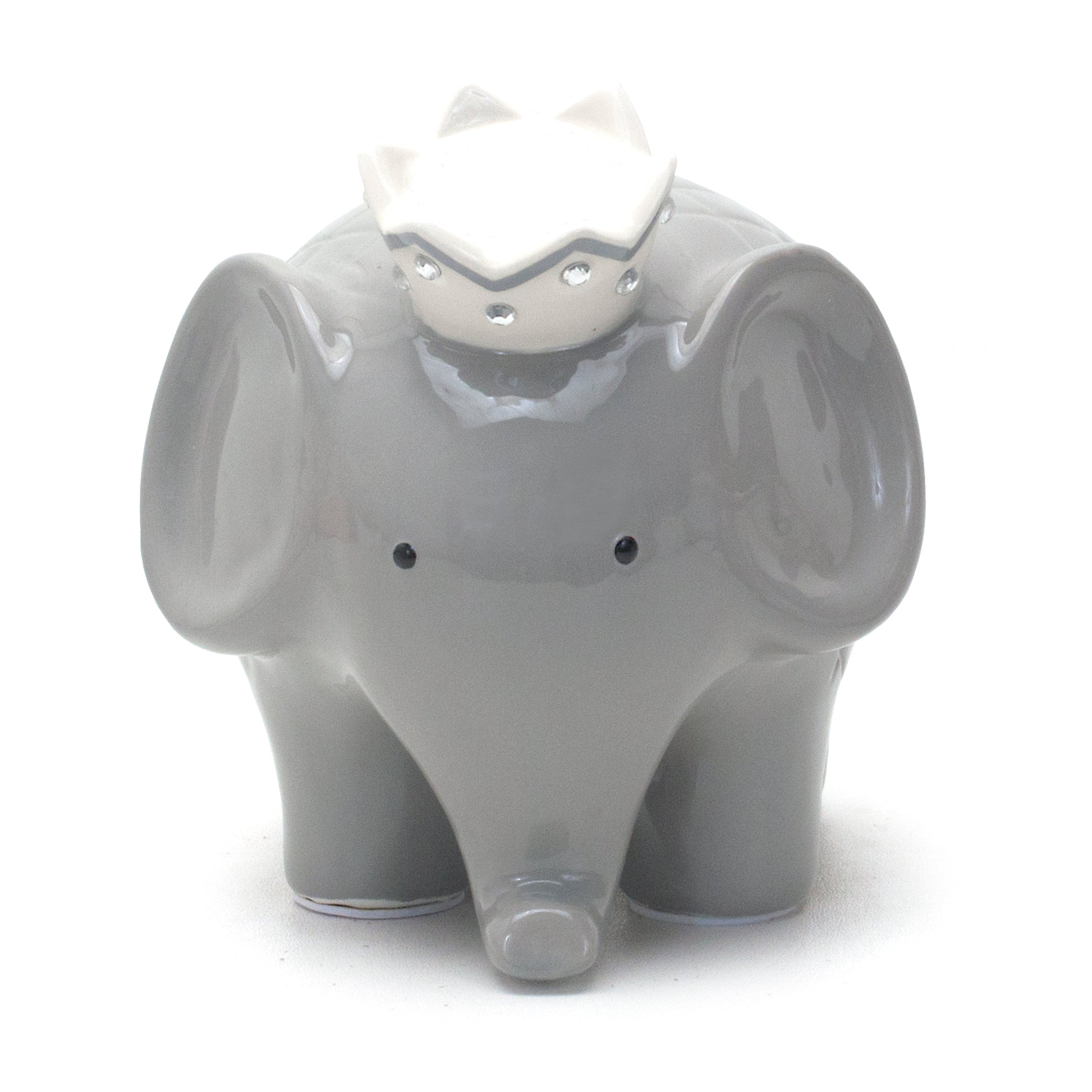Close-up left side of gray elephant piggy bank focusing on ear and crown
