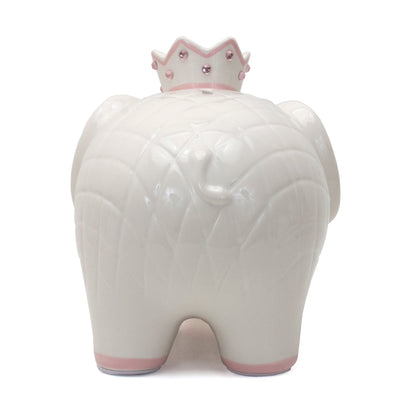 Rear view of white ceramic elephant piggy bank showing quilted texture and crown top coin slot