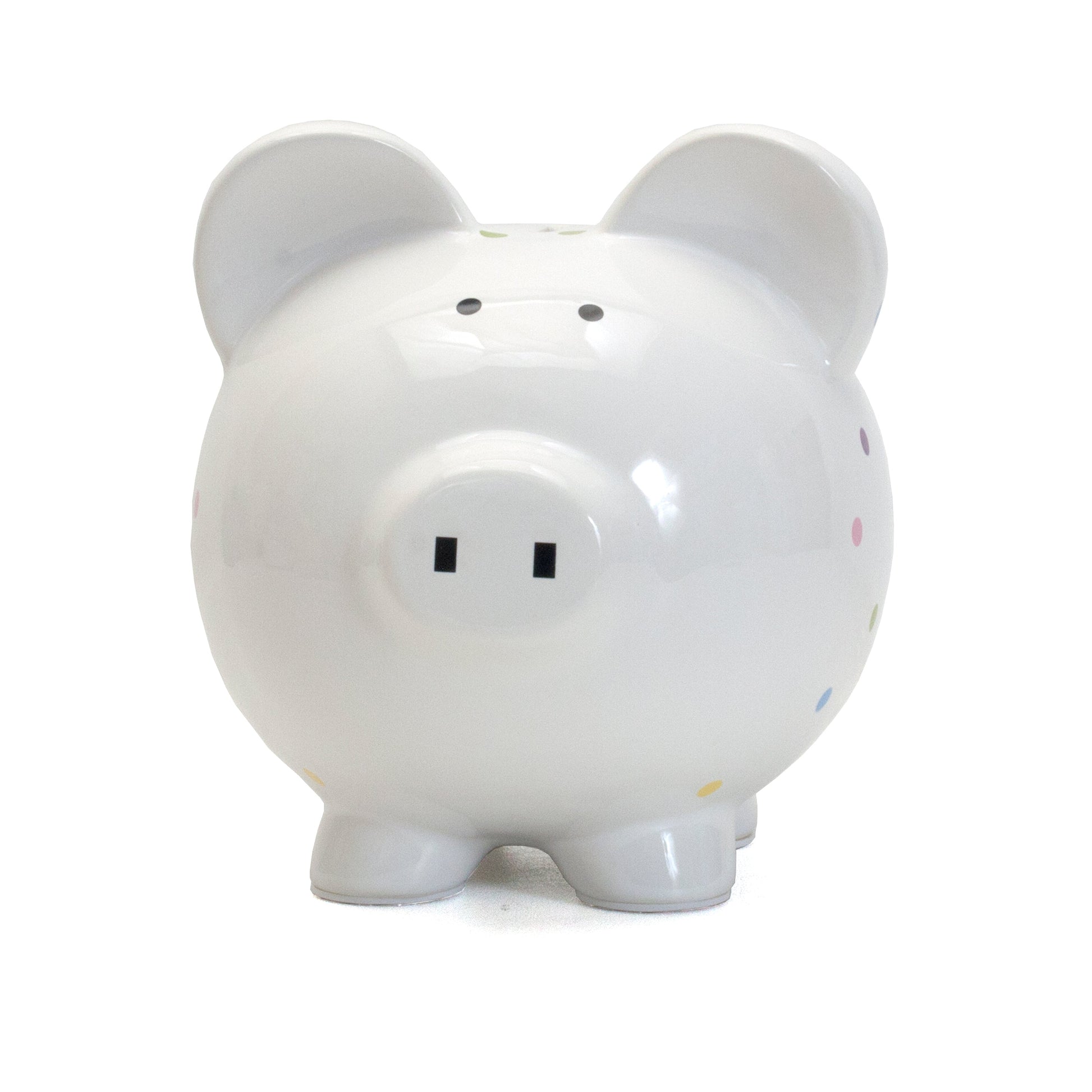 Front view of playful white ceramic piggy bank with black eyes and dot pattern