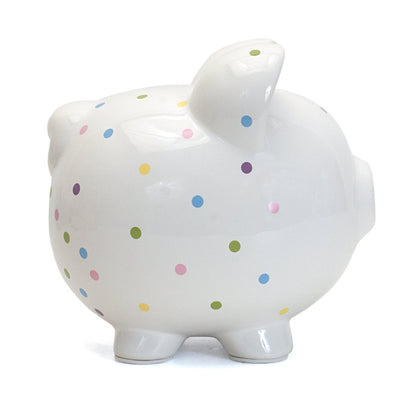 Side view showing glossy finish and polka dot pattern on piggy bank