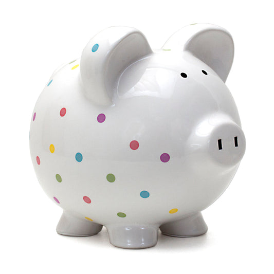 Front angled view of white ceramic piggy bank with colorful confetti dots