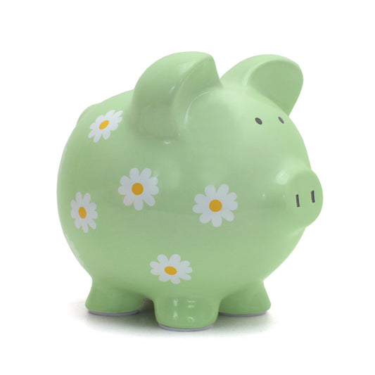 Green ceramic piggy bank with white and yellow daisy patterns, front angle