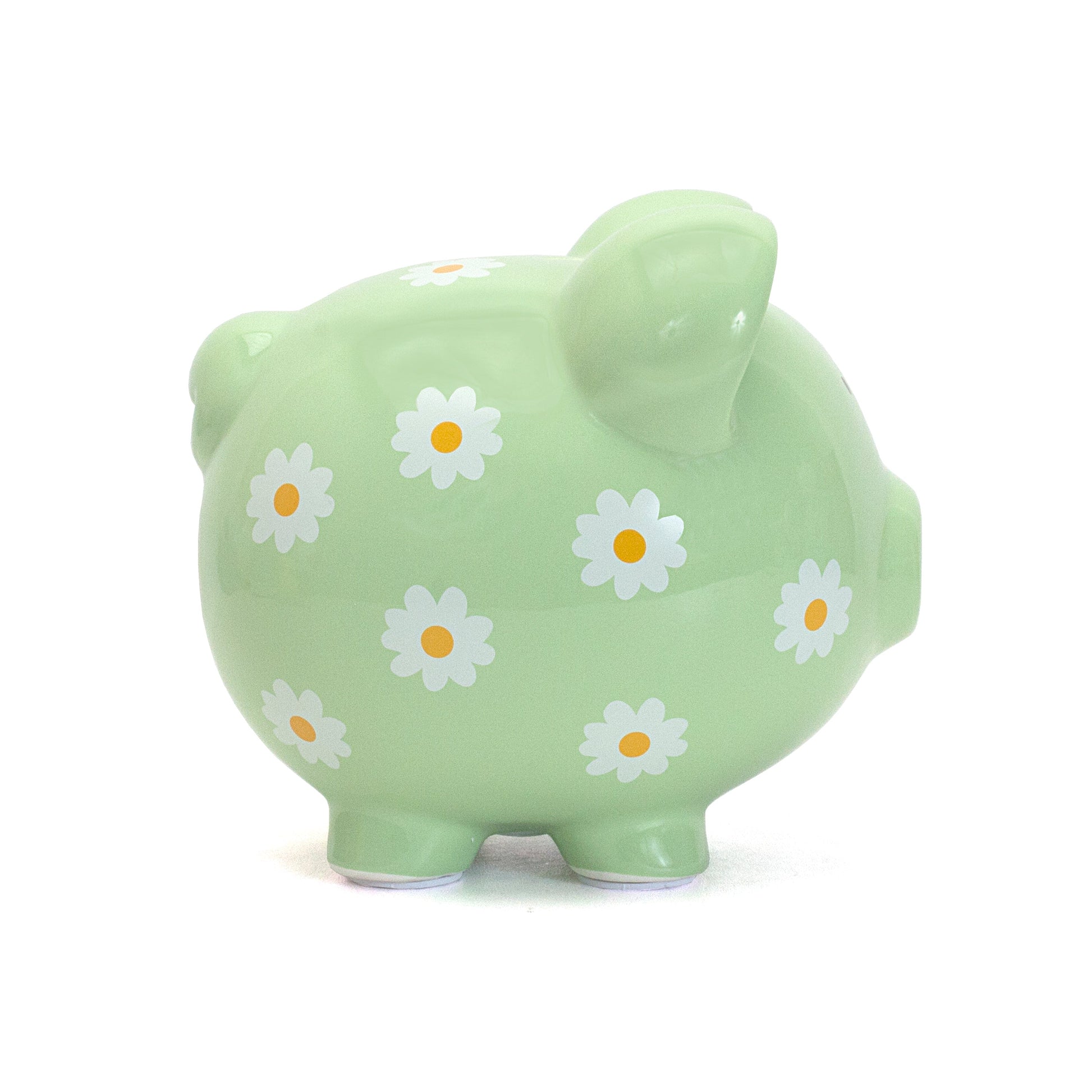 Side view of green piggy bank decorated with handpainted white daisies