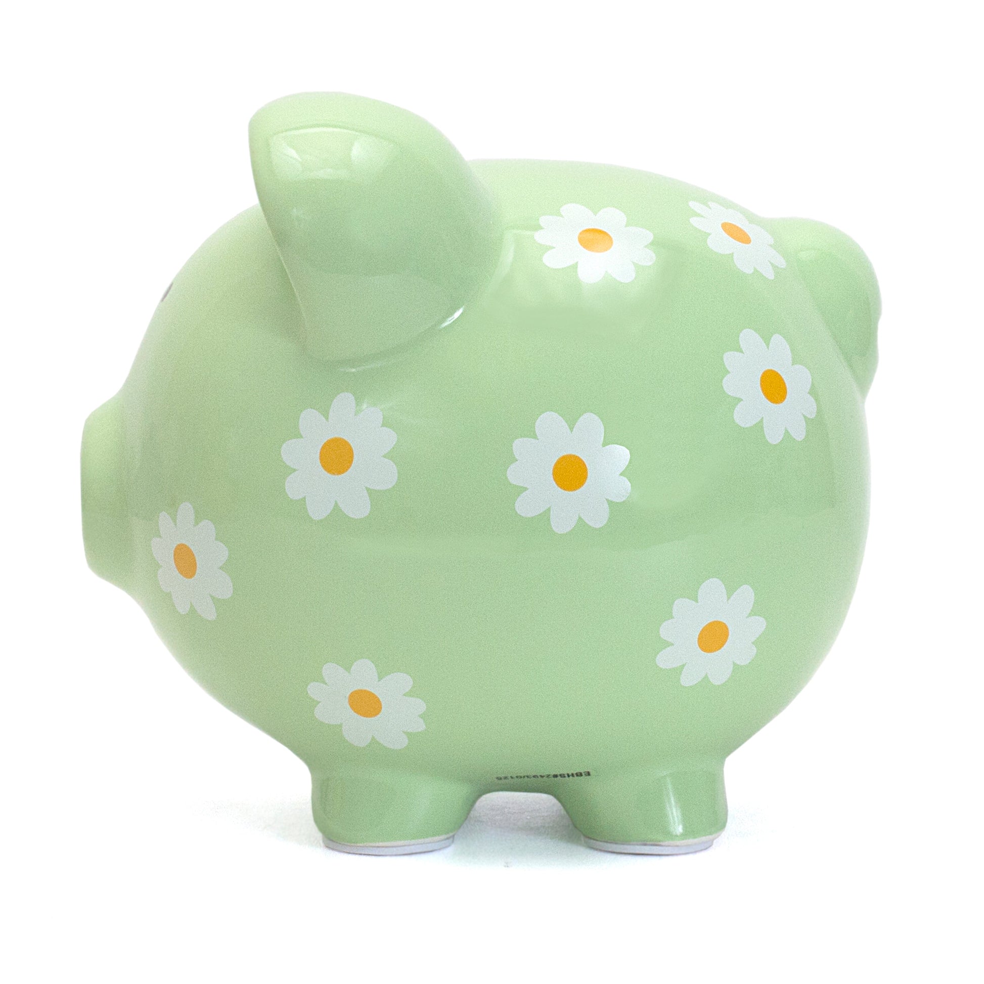 Close-up side profile of daisy-decorated piggy bank showing smooth ceramic finish