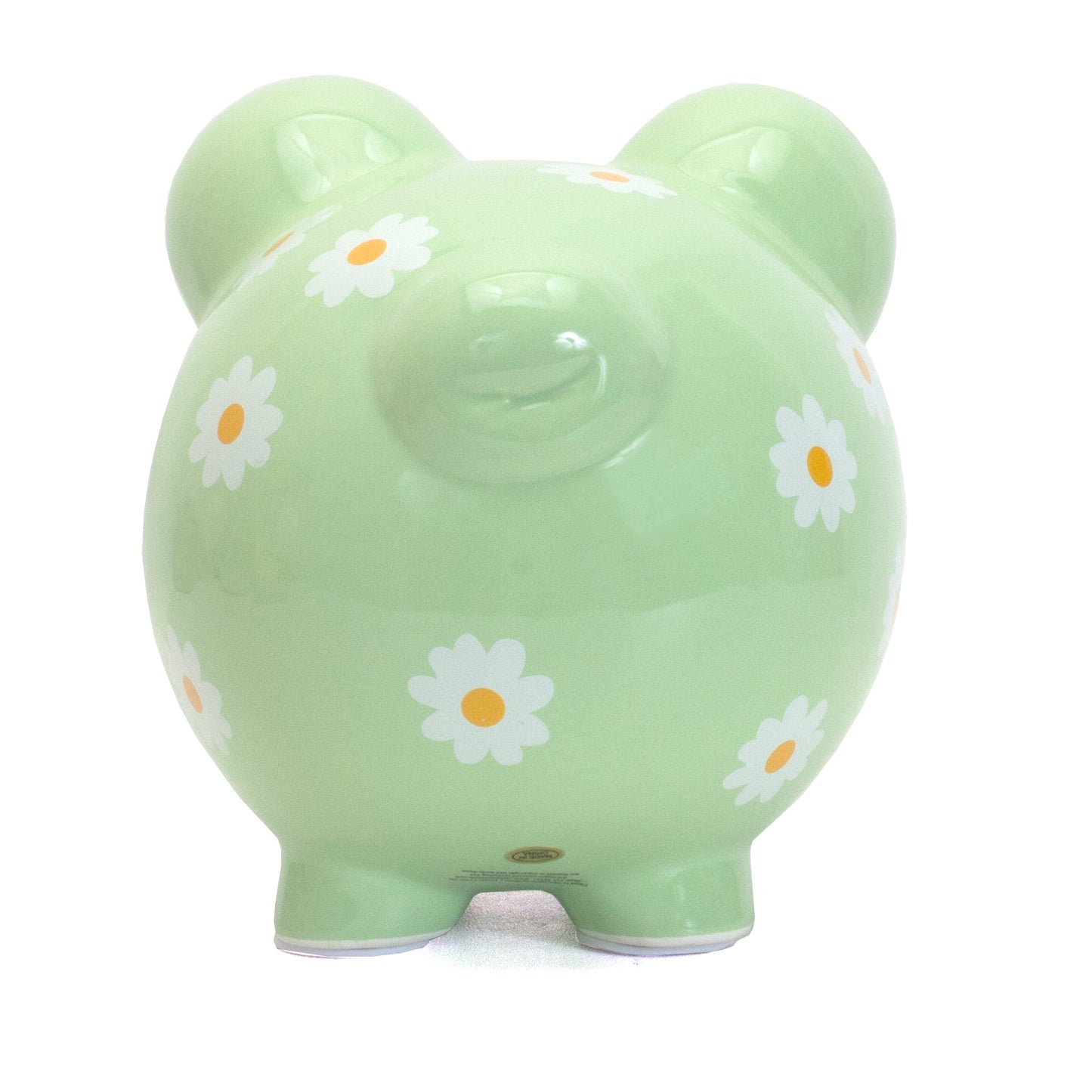 Front-facing view of pale green piggy bank with daisy prints and coin slot on top