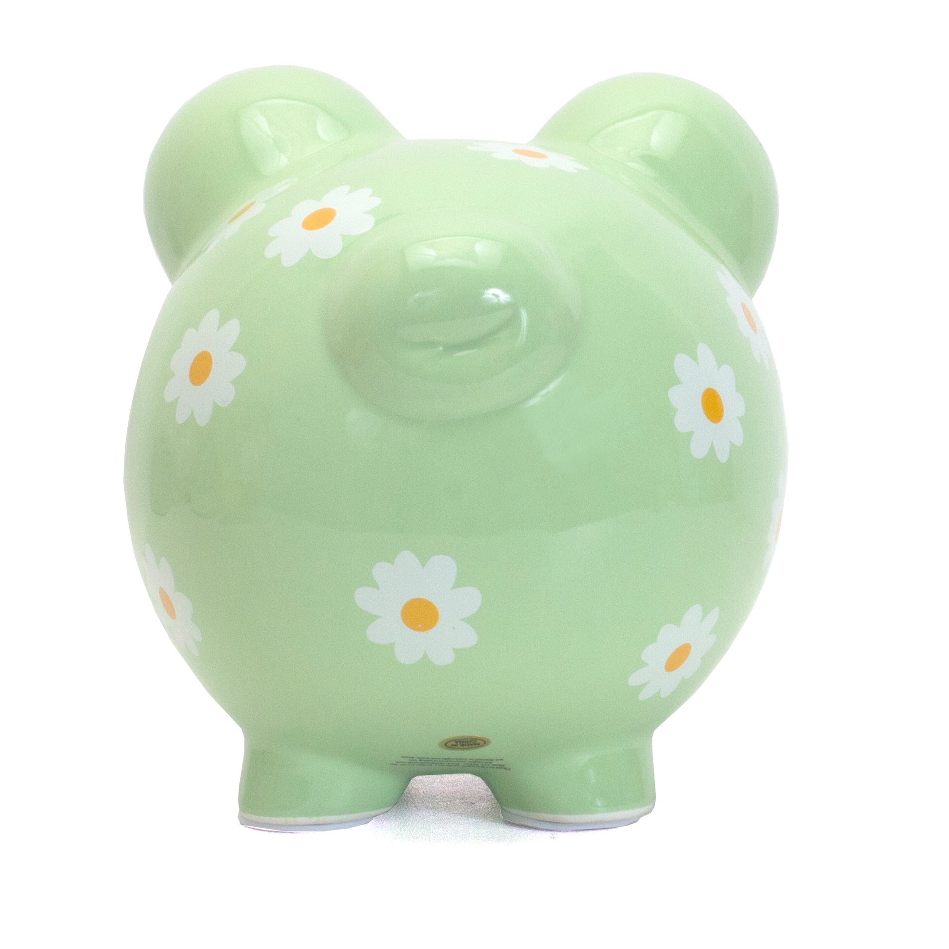 Front-facing view of pale green piggy bank with daisy prints and coin slot on top