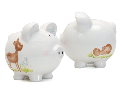 Close-up view of piggy bank's front face with handpainted features and coin slot