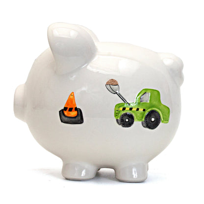 Right side view of piggy bank featuring green digger loading sand and an orange traffic cone
