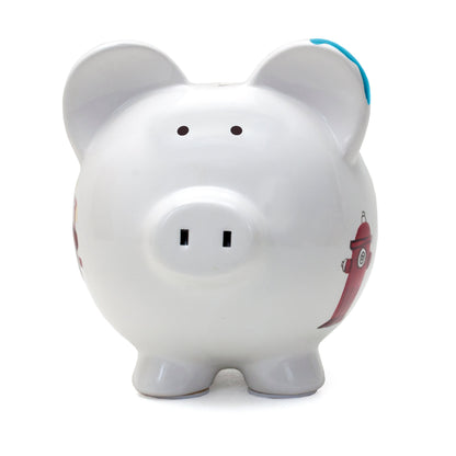 Side view of the piggy bank with painted firetruck featuring red wheels, American flag, and yellow hose detail