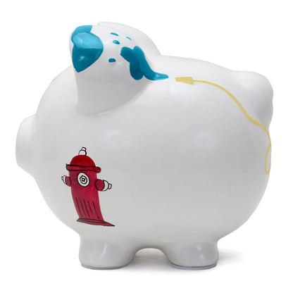 Back side of white ceramic piggy bank showing a red fire hydrant and turquoise paint accents on ears
