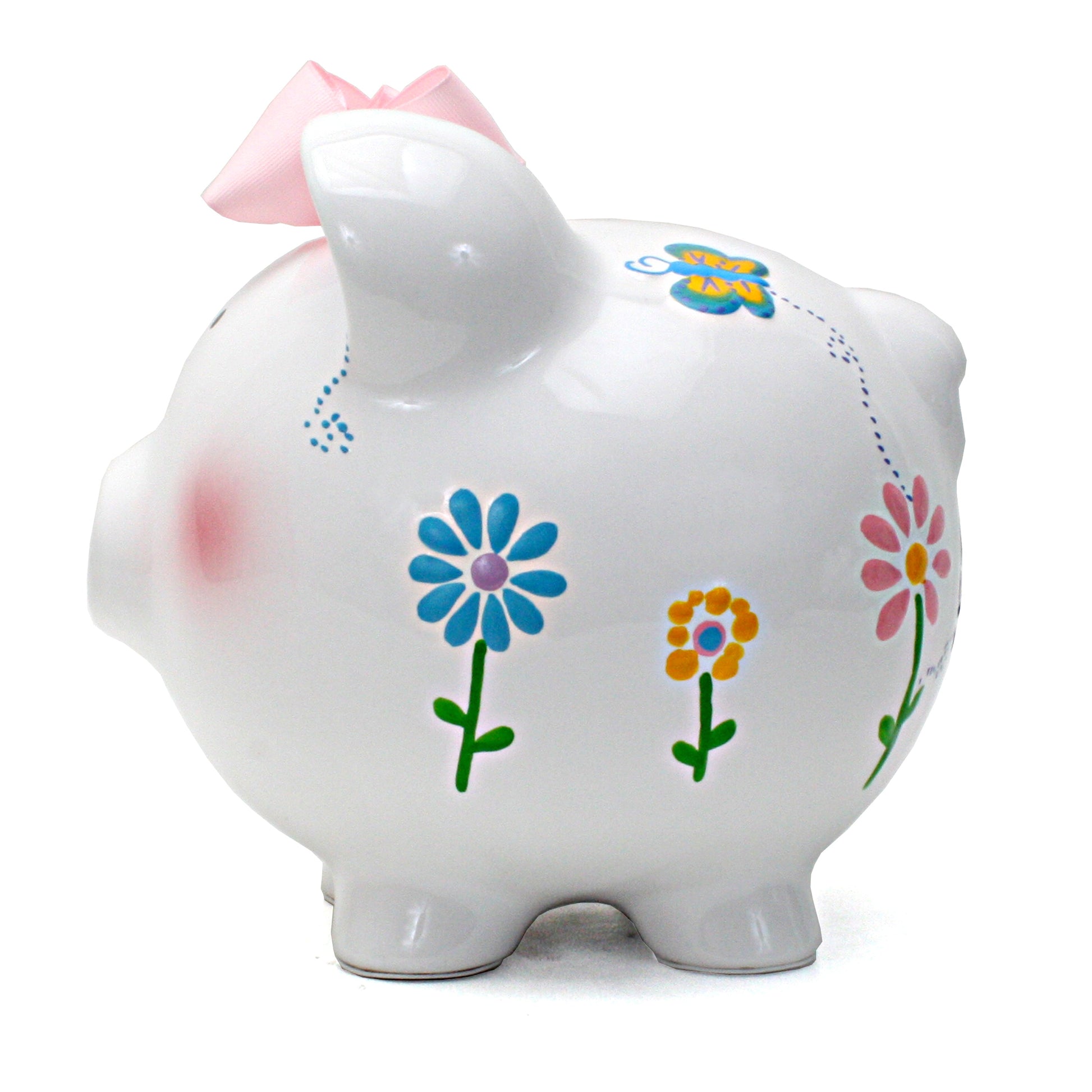 Side view showing colorful flower and butterfly handpainted designs on white piggy bank