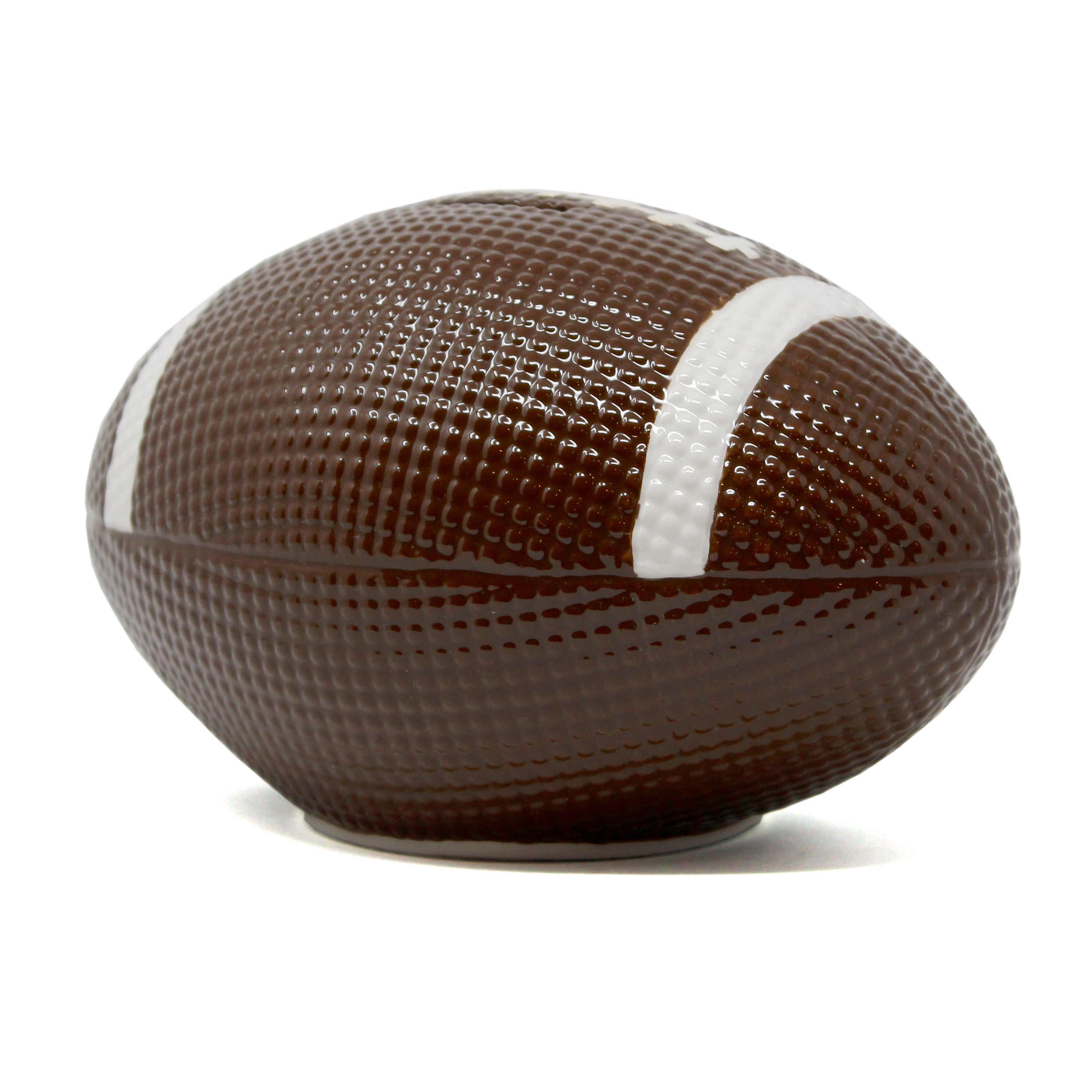 Ceramic football shaped money bank with white stripes and textured surface