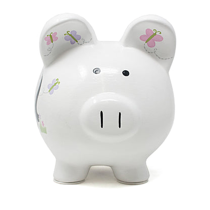 Front view of white piggy bank with black eyes and painted butterflies on ears