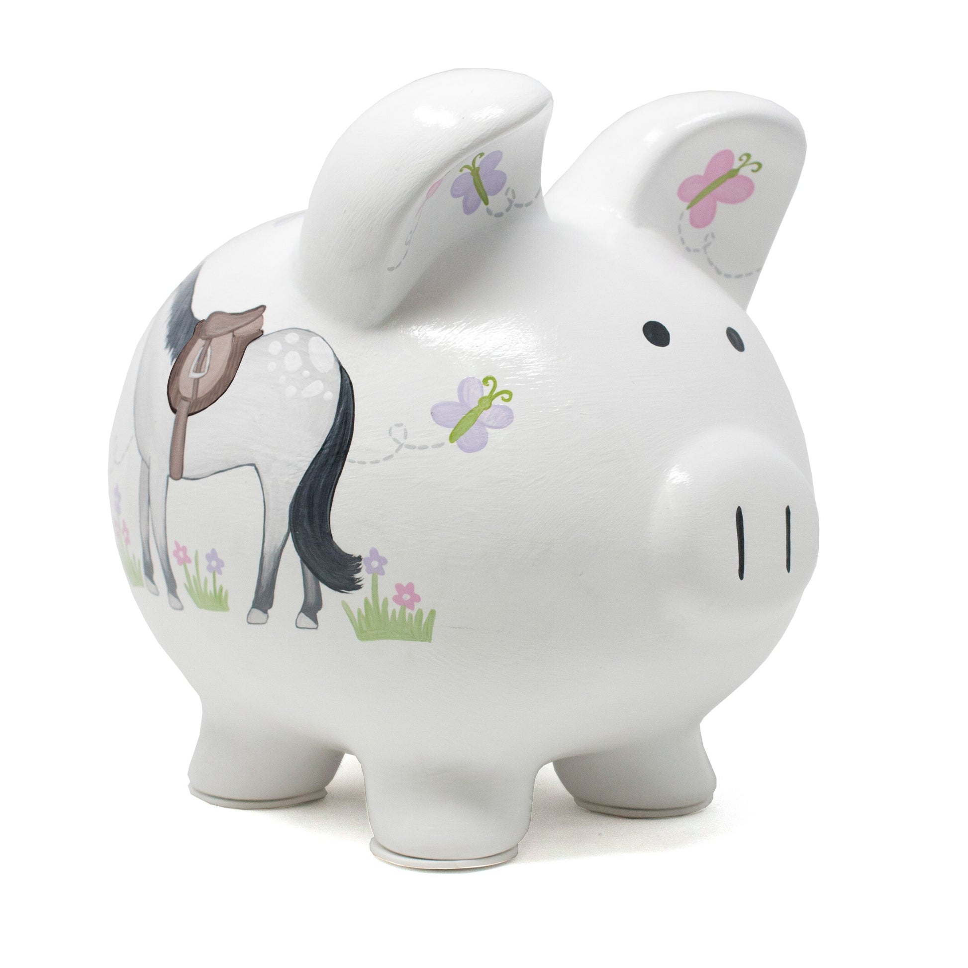 Side view of white piggy bank with handpainted horse and butterflies