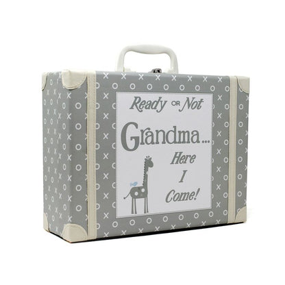 Side angle of gray kids suitcase showing pattern and handle