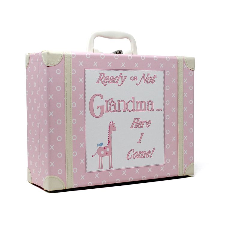 Angled side view of pink children's suitcase with white XO pattern and stitched white corners