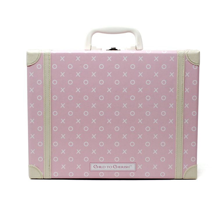 Back view of pink children's suitcase showing white XO pattern and Child to Cherish logo plaque