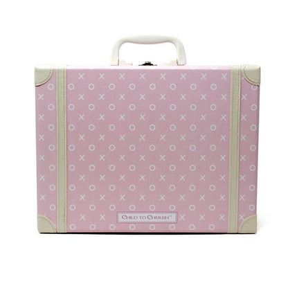 Back view of pink children's suitcase showing white XO pattern and Child to Cherish logo plaque
