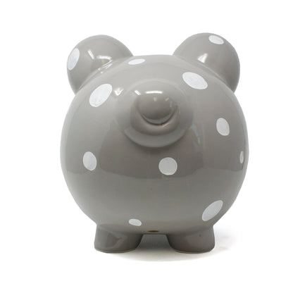 Rear view of gray ceramic piggy bank with white polka dots and four feet