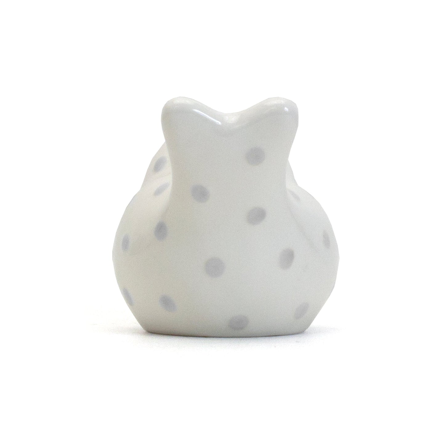 Back side view of gray dotted birdie piggy bank showing polka dot details