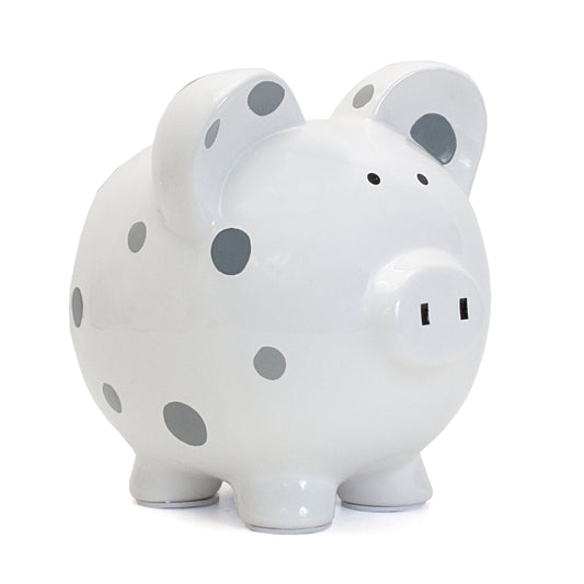Front angled view of a white piggy bank with handpainted gray polka dots