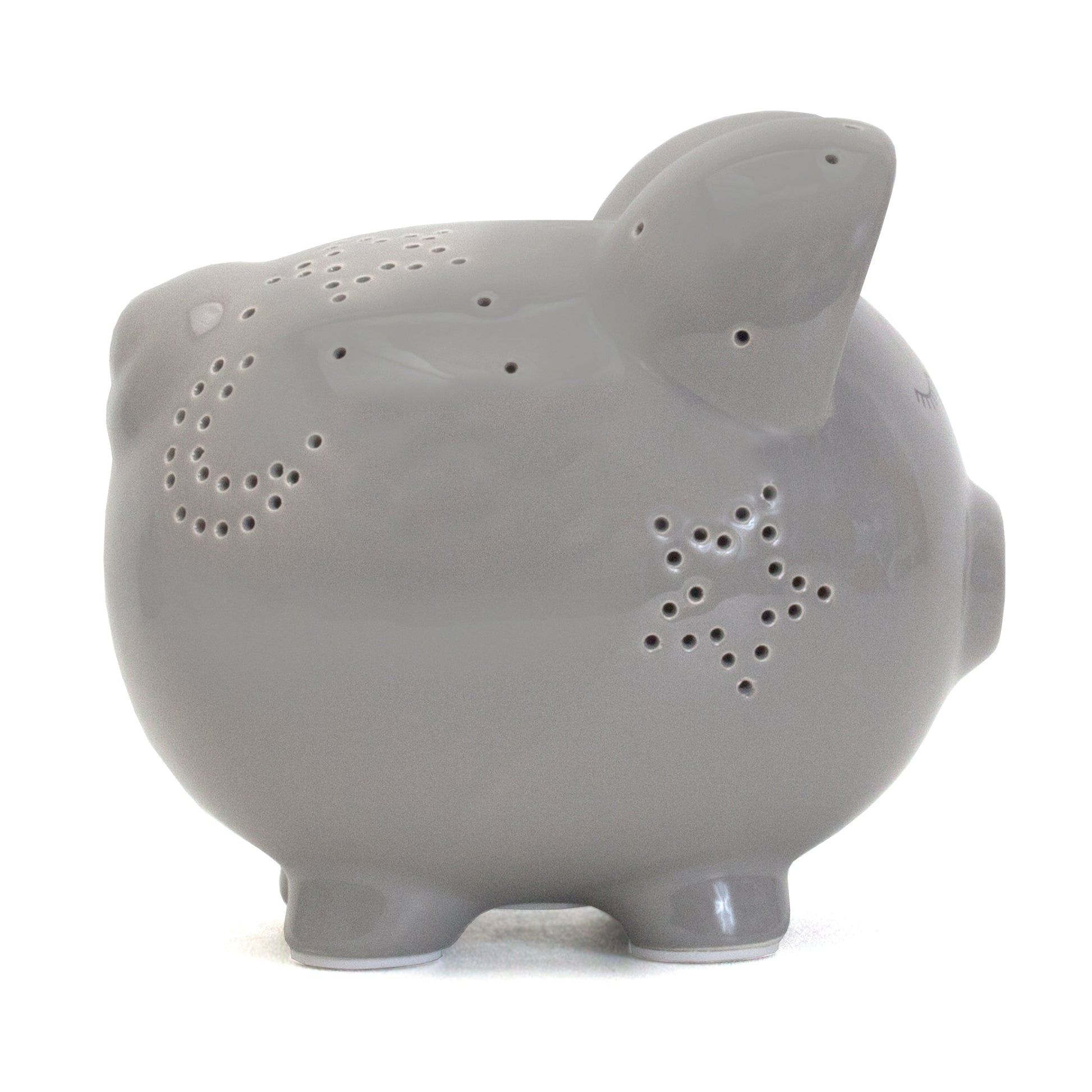 Opposite side view of gray ceramic pig with star perforation patterns