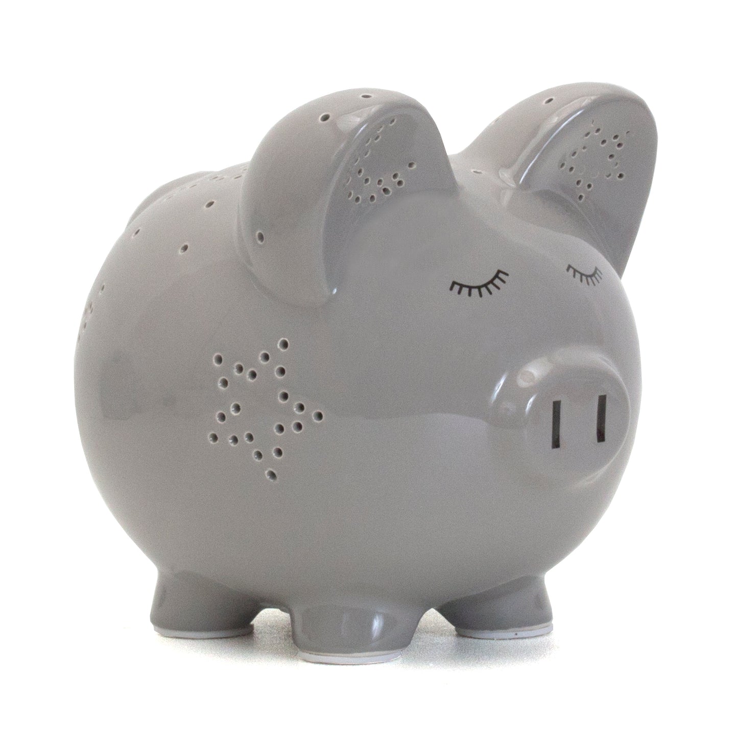Gray ceramic pig piggy bank with closed-eye face and star-shaped perforations