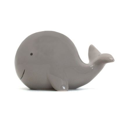 Gray ceramic whale piggy bank right side profile showing flipper and tail