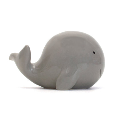 Gray ceramic whale piggy bank left side profile showing flipper and tail
