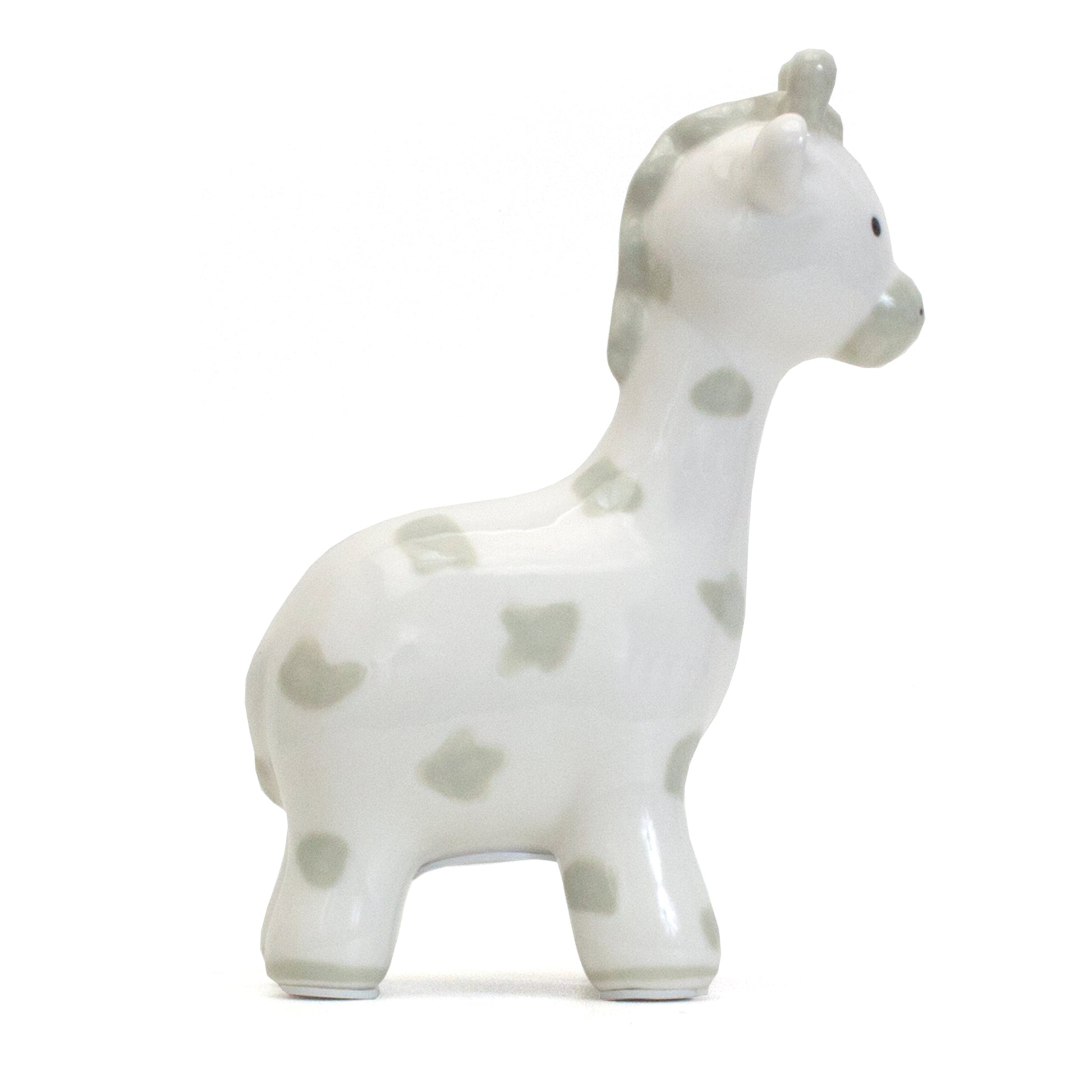 Left side view of gray spotted giraffe piggy bank